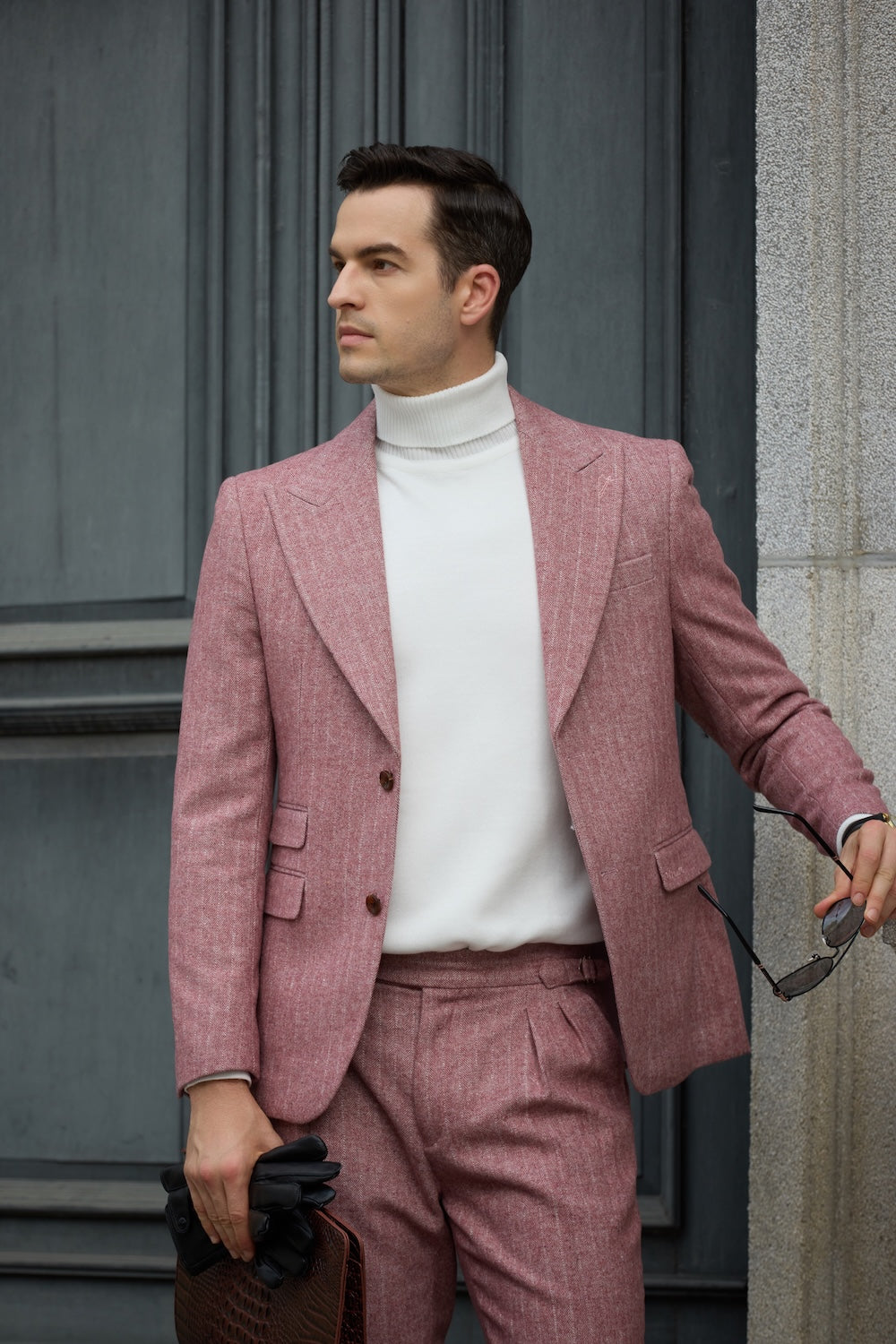 Close-up of red herringbone suit jacket lapel and white turtleneck pairing