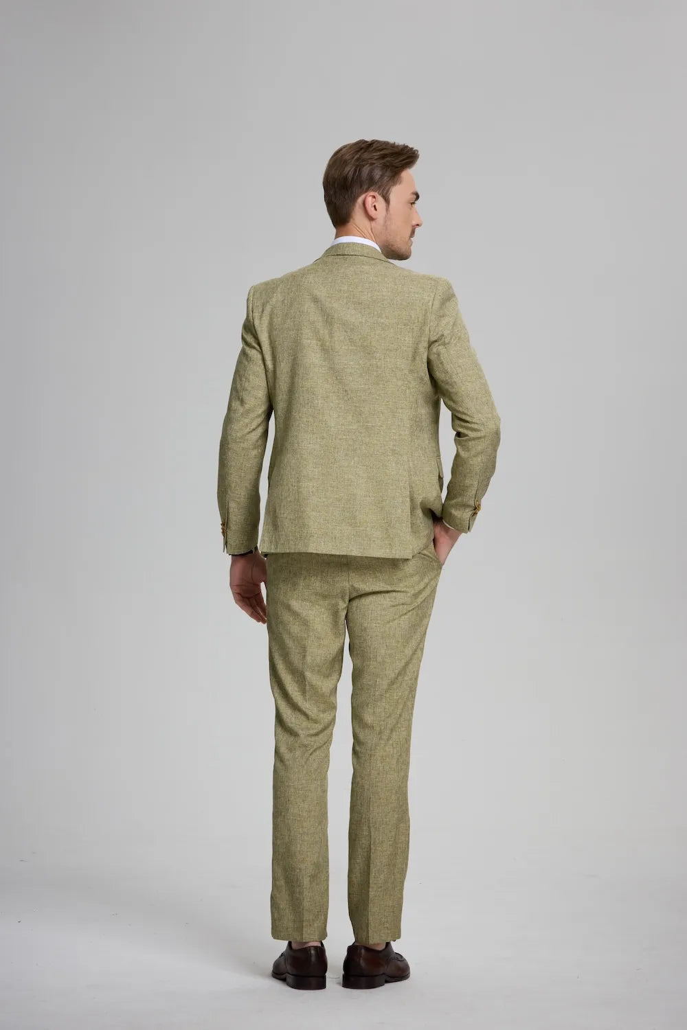 back view of men's green 3-piece suit with tailored blazer – perfect for any formal occasion