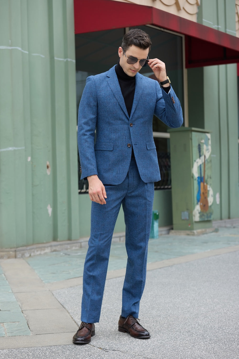 Front view of men's blue herringbone wool suit – classic casual business style