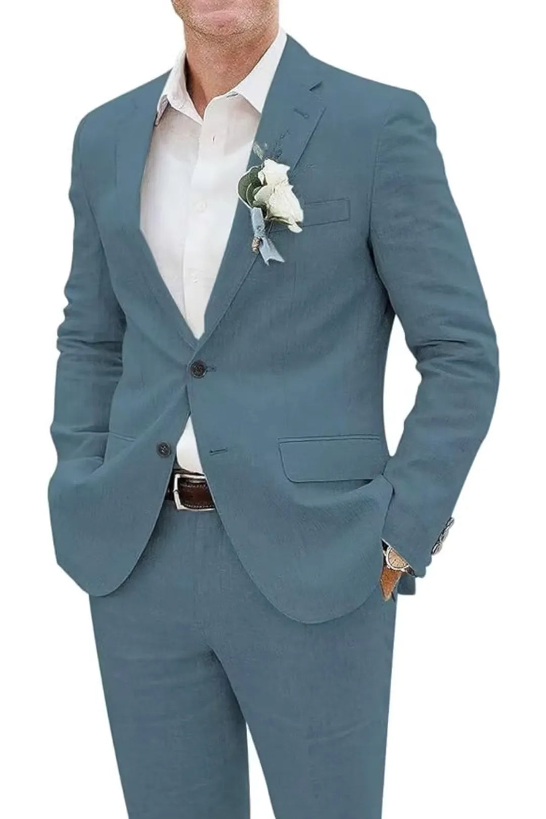 Close-up of dusty blue slim fit linen suit jacket with boutonniere and dress shirt – summer wedding style.