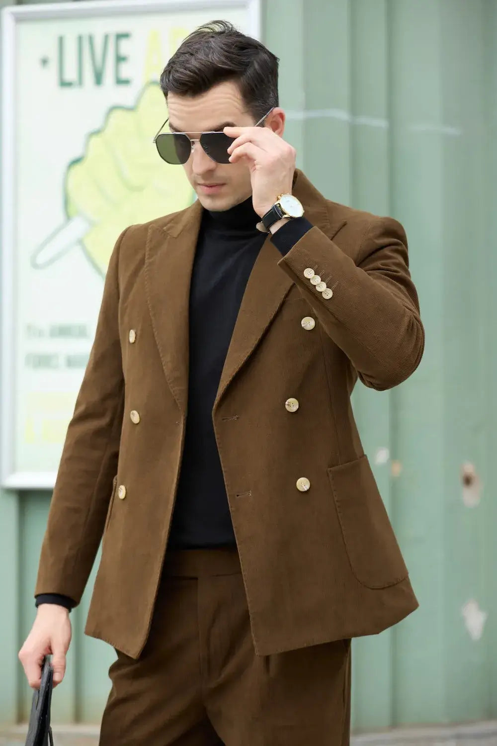 Man in coffee corduroy blazer adjusting sunglasses – vintage double breasted suit with elegant finish