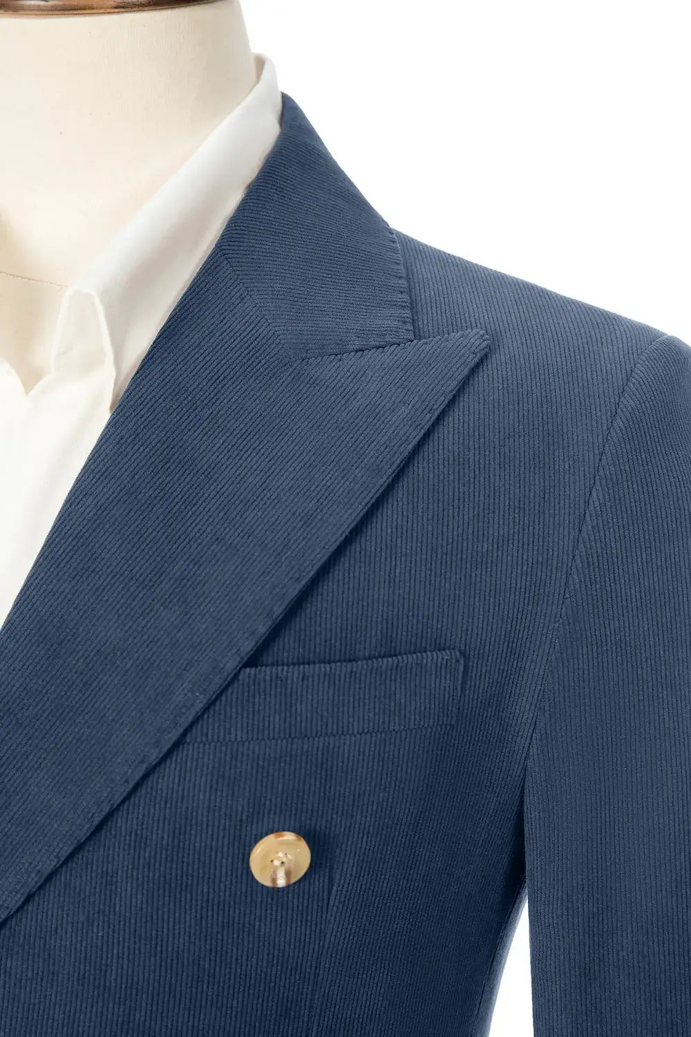Close-up of slate blue corduroy blazer lapel – peak lapel and fine texture