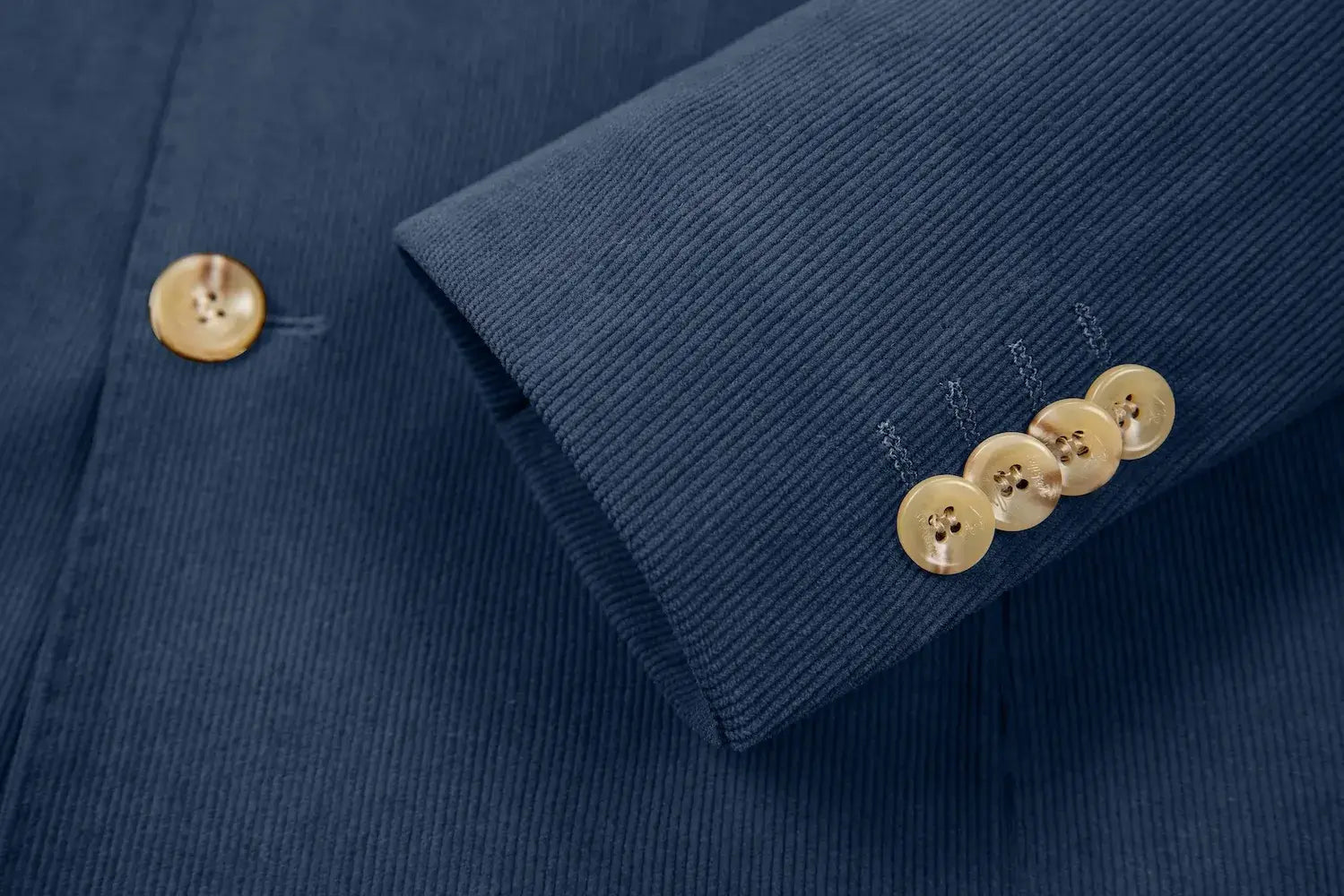 Detailed sleeve cuff of slate blue corduroy blazer – buttoned and tailored