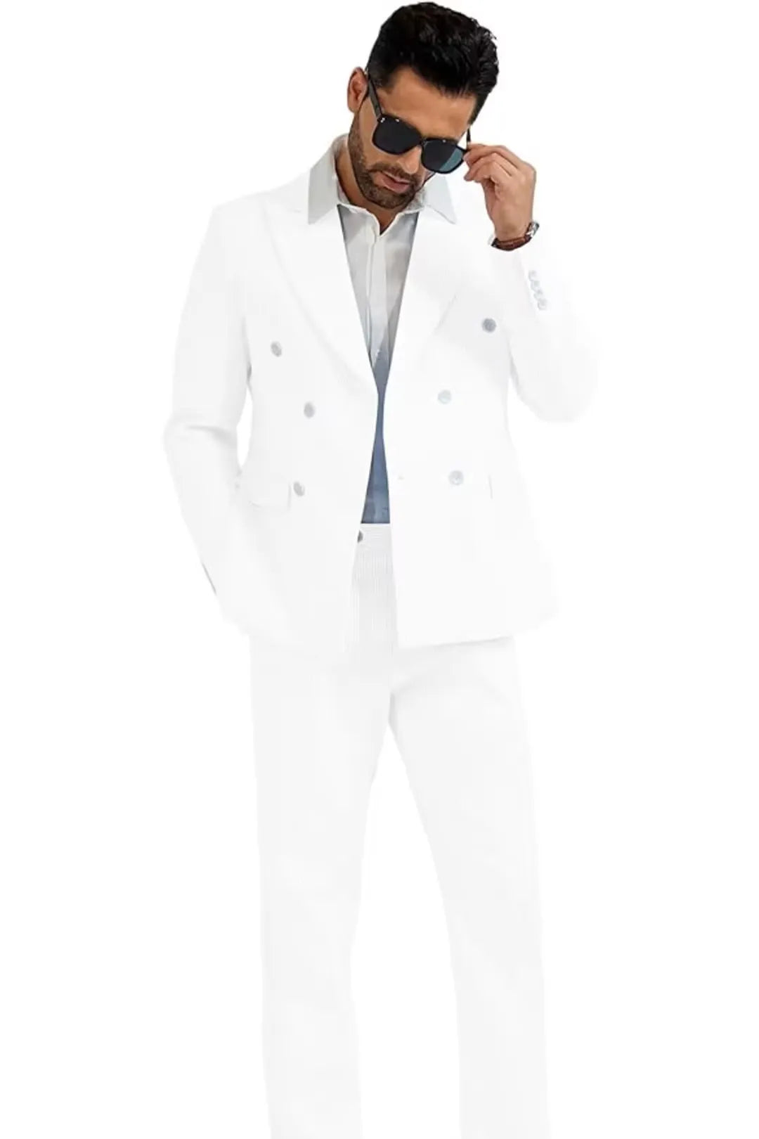 full body shot of model wearing men's white double-breasted seersucker suit, paired with a white shirt and sunglasses.